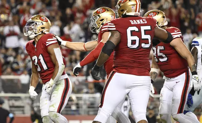 San Francisco 49ers running back Isaac Guerendo (31) celebrates after scoring against the Dallas Cowboys during the second half of an NFL football game in Santa Clara, Calif., Sunday, Oct. 27, 2024. (AP Photo/Eakin Howard)