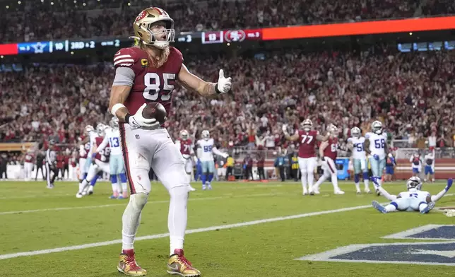 San Francisco 49ers tight end George Kittle (85) reacts after catching a touchdown pass against the Dallas Cowboys during the second half of an NFL football game in Santa Clara, Calif., Sunday, Oct. 27, 2024. (AP Photo/Tony Avelar)