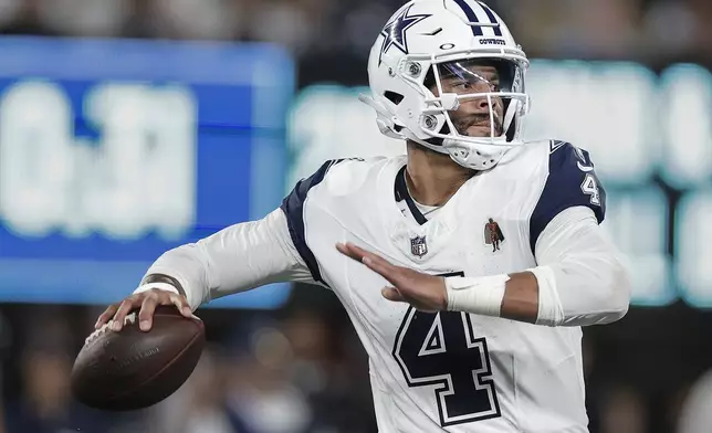 Dallas Cowboys quarterback Dak Prescott (4) passes against the New York Giants during the second quarter of an NFL football game, Thursday, Sept. 26, 2024, in East Rutherford, N.J. (AP Photo/Adam Hunger)