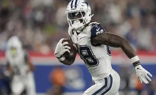 Dallas Cowboys wide receiver CeeDee Lamb (88) runs for a touchdown against the New York Giants during the second quarter of an NFL football game, Thursday, Sept. 26, 2024, in East Rutherford, N.J. (AP Photo/Bryan Woolston)