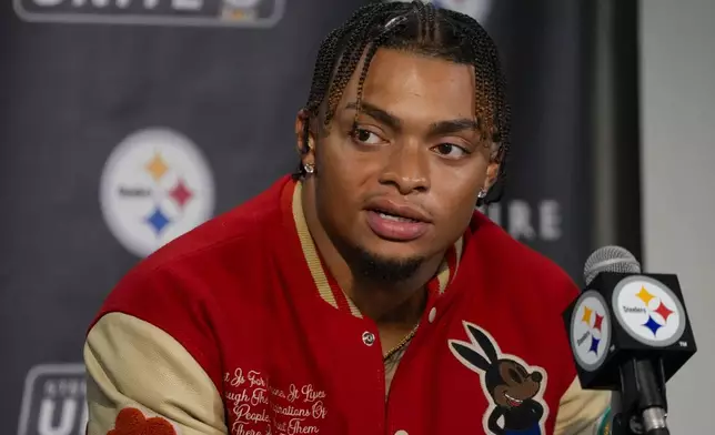 Pittsburgh Steelers quarterback Justin Fields talks to reporters following an NFL football game against the Dallas Cowboys, early Monday, Oct. 7, 2024, in Pittsburgh. The Cowboys won 20-17. (AP Photo/Gene J. Puskar)