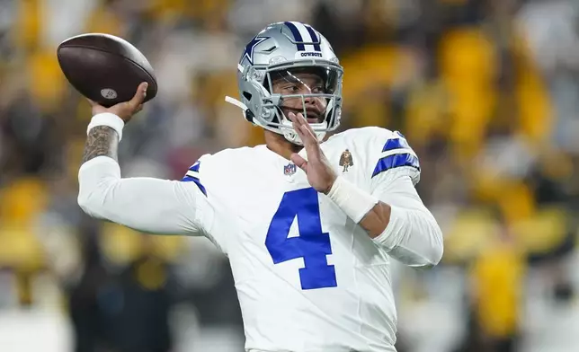 Dallas Cowboys quarterback Dak Prescott works out prior to an NFL football game against the Pittsburgh Steelers, Sunday, Oct. 6, 2024, in Pittsburgh. (AP Photo/Matt Freed)