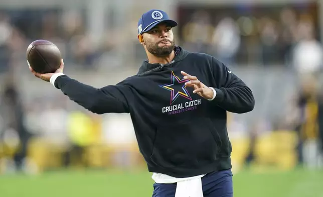 Dallas Cowboys quarterback Dak Prescott works out prior to an NFL football game against the Pittsburgh Steelers, Sunday, Oct. 6, 2024, in Pittsburgh. (AP Photo/Matt Freed)