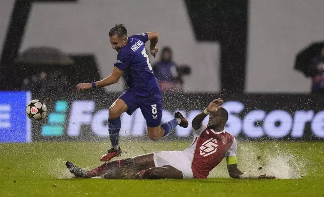 Dinamo's Lukas Kacavenda escapes the tackle by Monaco's Denis Zakaria during the Champions League soccer match between Dinamo Zagreb and Monaco at Maksimir stadium in Zagreb, Croatia, Wednesday, Oct. 2, 2024. (AP Photo/Darko Bandic)