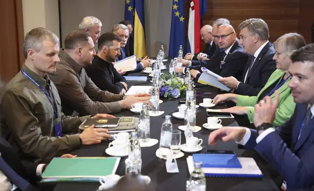 Ukrainian President Volodymyr Zelenskyy, centre left, attends a meeting with Croatian Prime Minister Andrej Plenkovic, third from right, at the Southeast Europe Croatia Ukraine summit in Dubrovnik, Croatia, Wednesday, Oct. 9, 2024. (Damir Sencar/Pool Photo via AP)