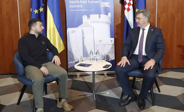 Ukrainian President Volodymyr Zelenskyy, left, meets Croatian Prime Minister Andrej Plenkovic at the Southeast Europe Croatia Ukraine summit in Dubrovnik, Croatia, Wednesday, Oct. 9, 2024. (Damir Sencar/Pool Photo via AP)