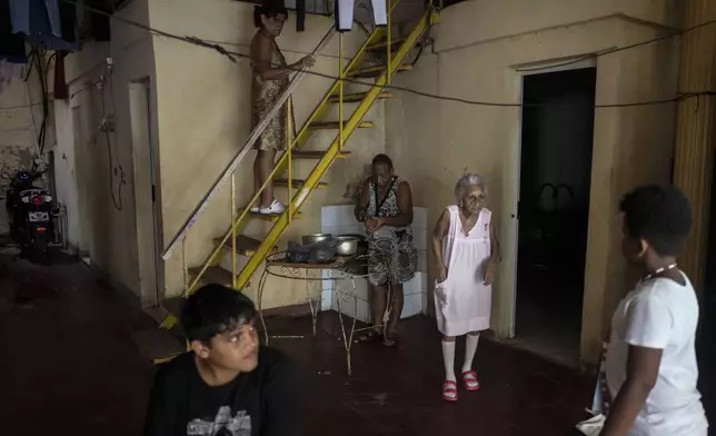 Residents endure the heat during a massive blackout after a major power plant failed in Havana, Cuba, Saturday, Oct. 19, 2024. (AP Photo/Ramon Espinosa)