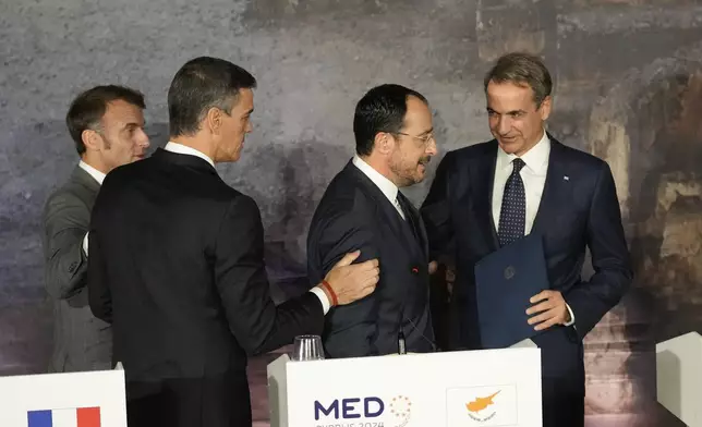 From left to right French President Emmanuel Macron, Spain's Prime minister Pedro Sanchez, Cyprus' President Nikos Christodoulides, and Greece's Prime Minister Kyriakos Mitsotakis chat after the end of a press conference in Paphos ,Cyprus, on Friday, Oct 11, 2024 as the leaders of nine southern European Union member countries and Jordan are meeting to come up with ways of de-escalating the conflict in the Middle East (AP Photo/Petros Karadjias)