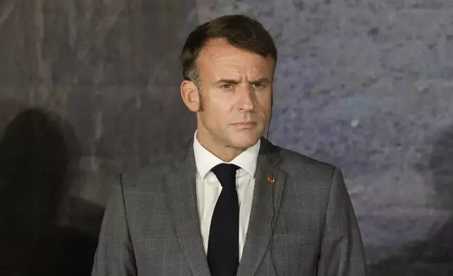 French President Emmanuel Macron, listens during a news press conference in Paphos ,Cyprus, on Friday, Oct 11, 2024 as the leaders of nine southern European Union member countries and Jordan are meeting to come up with ways of de-escalating the conflict in the Middle East (AP Photo/Petros Karadjias)