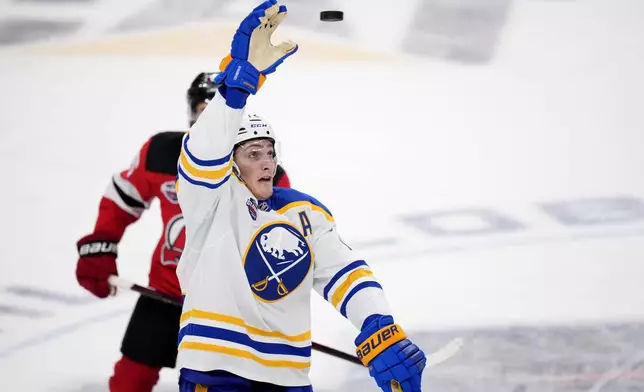 Buffalo Sabres' Tage Thompson catches the puck during the NHL hockey game between Buffalo Sabres and New Jersey Devils, in Prague, Czech Republic, Saturday, Oct. 5, 2024. (AP Photo/Petr David Josek)