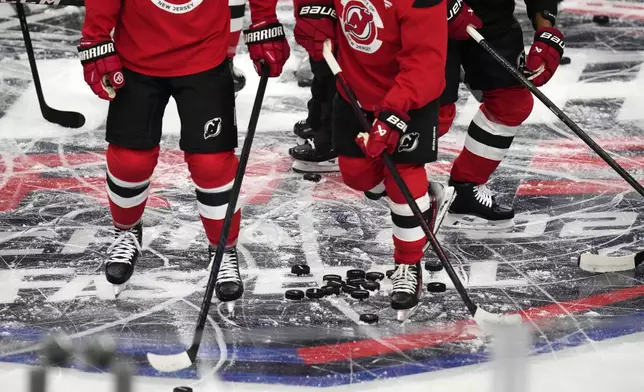 New Jersey Devils' attend a practice session, a day before their NHL hockey game against Buffalo Sabres, in Prague, Czech Republic, Thursday, Oct. 3, 2024. (AP Photo/Petr David Josek)