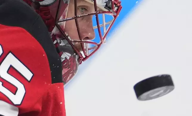 New Jersey goaltender Devils' Jacob Markstrom watches the puck during the NHL hockey game between Buffalo Sabres and New Jersey Devils, in Prague, Czech Republic, Friday, Oct. 4, 2024. (AP Photo/Petr David Josek)