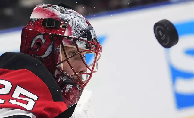 New Jersey goaltender Devils' Jacob Markstrom watches the puck during the NHL hockey game between Buffalo Sabres and New Jersey Devils, in Prague, Czech Republic, Friday, Oct. 4, 2024. (AP Photo/Petr David Josek)