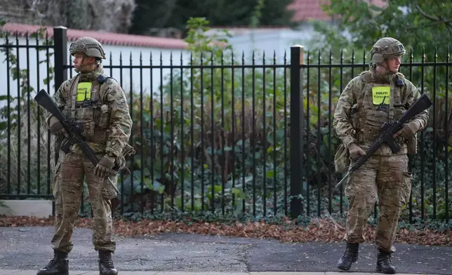 Military police officers stand guard as police investigate two explosions near the Israeli embassy in Copenhagen, Wednesday, Oct. 2, 2024. (Emil Nicolai Helms/Ritzau Scanpix via AP)