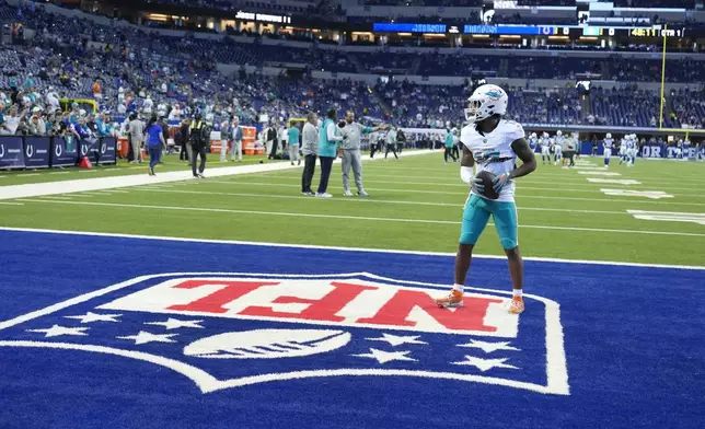 Miami Dolphins wide receiver Jaylen Waddle warms up before the start of an NFL football game against the Indianapolis Colts, Sunday, Oct. 20, 2024 in Indianapolis. (AP Photo/Michael Conroy)