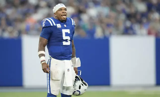 Indianapolis Colts quarterback Anthony Richardson watches from the sideline during the second half of an NFL football game against the Miami Dolphins, Sunday, Oct. 20, 2024 in Indianapolis. (AP Photo/AJ Mast)