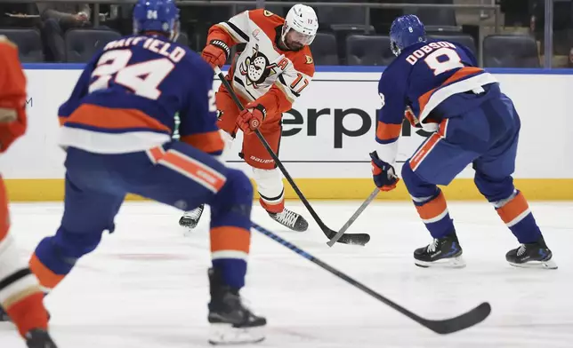 Anaheim Ducks' Alex Killorn looks to pass the puck during the first period of an NHL game against the New York Islanders, Tuesday, Oct. 29, 2024 in Elmont, N.Y. (AP Photo/Heather Khalifa)