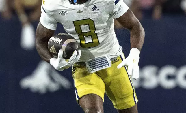 Georgia Tech Yellow Jackets wide receiver Malik Rutherford (8) runs the ball after a catch in the first quarter of a football game against the Duke BlueDevils, Saturday, Oct. 5, 2024, in Atlanta. (AP Photo/Jason Allen)