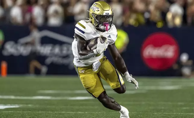 Georgia Tech Yellow Jackets running back Jamal Haynes (11) runs the ball in the first quarter of a football game against the Duke BlueDevils, Saturday, Oct. 5, 2024, in Atlanta. (AP Photo/Jason Allen)