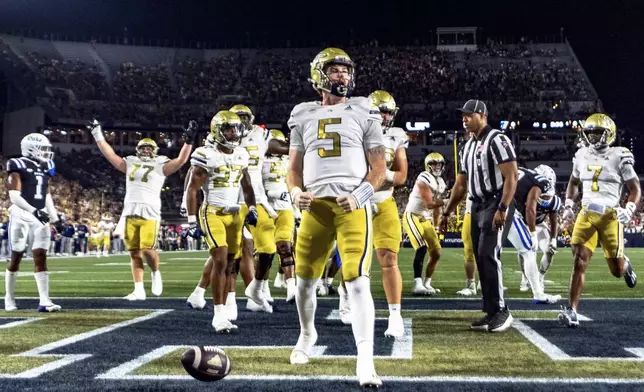 Georgia Tech Yellow Jackets quarterback Zach Pyron (5) celebrates in the end zone after a rushing touchdown in the first quarter of a football game against the Duke BlueDevils, Saturday, Oct. 5, 2024, in Atlanta. (AP Photo/Jason Allen)