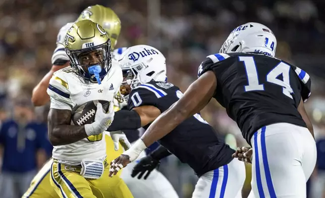 Georgia Tech Yellow Jackets wide receiver Malik Rutherford (8) breaks a tackle in the first quarter of a football game against the Duke BlueDevils, Saturday, Oct. 5, 2024, in Atlanta. (AP Photo/Jason Allen)