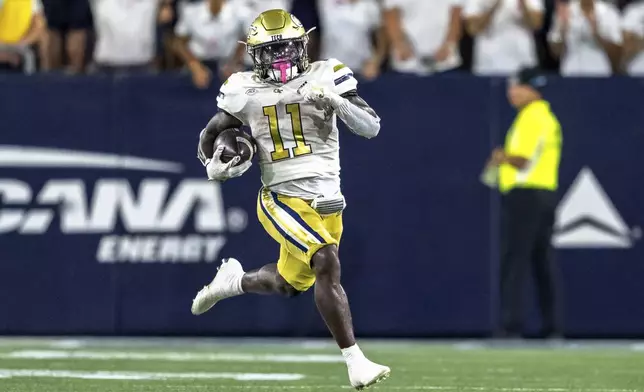 Georgia Tech Yellow Jackets running back Jamal Haynes (11) runs the ball in the first quarter of a football game against the Duke BlueDevils, Saturday, Oct. 5, 2024, in Atlanta. (AP Photo/Jason Allen)