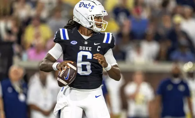 Duke Blue Devils quarterback Maalik Murphy (6) drops back to pass in the first quarter of a football game against the Georgia Tech Yellowjackets, Saturday, Oct. 5, 2024, in Atlanta. (AP Photo/Jason Allen)