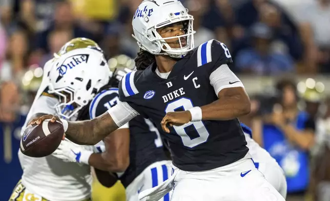 Duke Blue Devils quarterback Maalik Murphy (6) drops back to pass in the first quarter of a football game against the Georgia Tech Yellowjackets, Saturday, Oct. 5, 2024, in Atlanta. (AP Photo/Jason Allen)