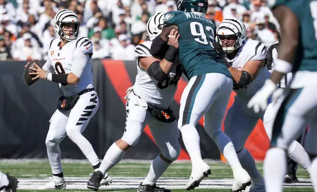 Cincinnati Bengals quarterback Joe Burrow looks to pass against the Philadelphia Eagles during the first half of an NFL football game, Sunday, Oct. 27, 2024 in Cincinnati. (AP Photo/Jeff Dean)