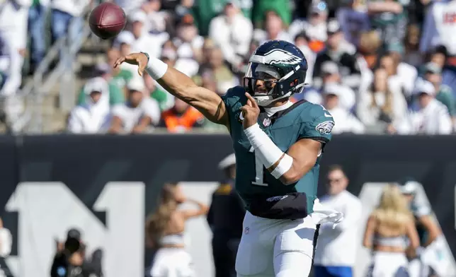 Philadelphia Eagles quarterback Jalen Hurts throws a pass against the Cincinnati Bengals during the first half of an NFL football game, Sunday, Oct. 27, 2024 in Cincinnati. (AP Photo/Jeff Dean)