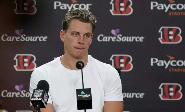 Cincinnati Bengals quarterback Joe Burrow talks to reporters following an NFL football game against the Philadelphia Eagles, Sunday, Oct. 27, 2024, in Cincinnati. The Eagles won 37-17. (AP Photo/Jeff Dean)