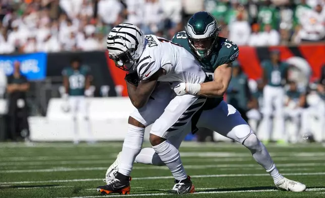 Cincinnati Bengals wide receiver Ja'Marr Chase, left, is tackled by Philadelphia Eagles cornerback Cooper DeJean during the second half of an NFL football game, Sunday, Oct. 27, 2024 in Cincinnati. (AP Photo/Jeff Dean)