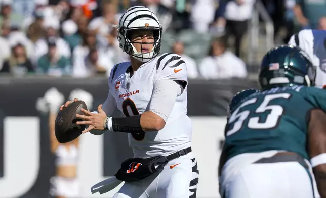 Cincinnati Bengals quarterback Joe Burrow looks to pass against the Philadelphia Eagles during the first half of an NFL football game, Sunday, Oct. 27, 2024 in Cincinnati. (AP Photo/Jeff Dean)