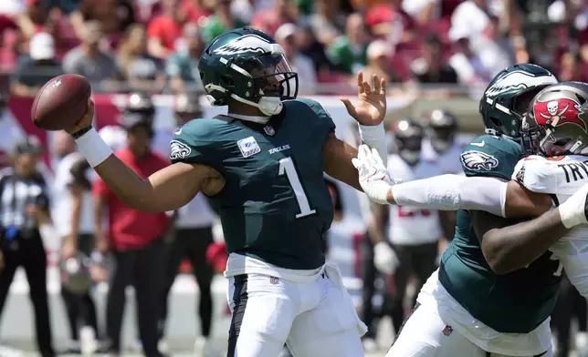 Philadelphia Eagles' Jalen Hurts passes during the first half of an NFL football game against the Tampa Bay Buccaneers, Sunday, Sept. 29, 2024, in Tampa, Fla. (AP Photo/Chris O'Meara)