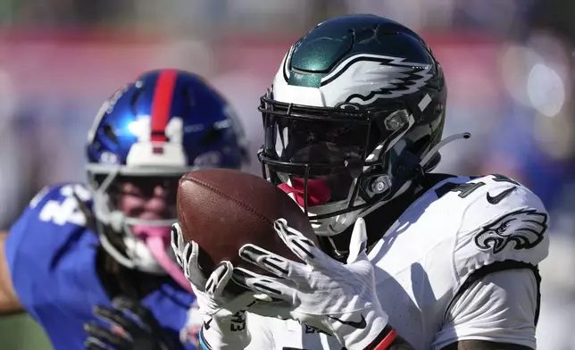 Philadelphia Eagles wide receiver A.J. Brown (11) makes a touchdown catch against the New York Giants during the second quarter of an NFL football game, Sunday, Oct. 20, 2024, in East Rutherford, N.J. (AP Photo/Seth Wenig)