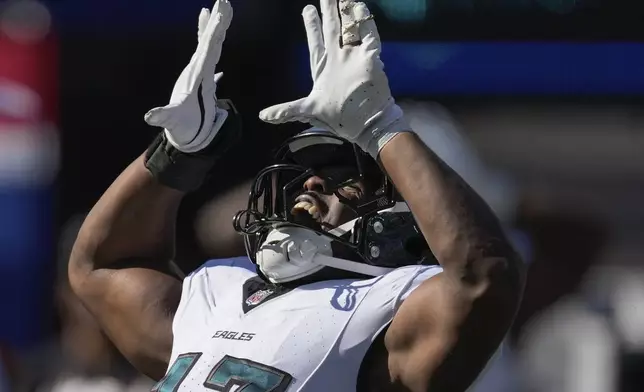 Philadelphia Eagles linebacker Nakobe Dean (17) reacts after sacking New York Giants quarterback Daniel Jones (8) during the first half of an NFL football game, Sunday, Oct. 20, 2024, in East Rutherford, N.J. (AP Photo/Seth Wenig)