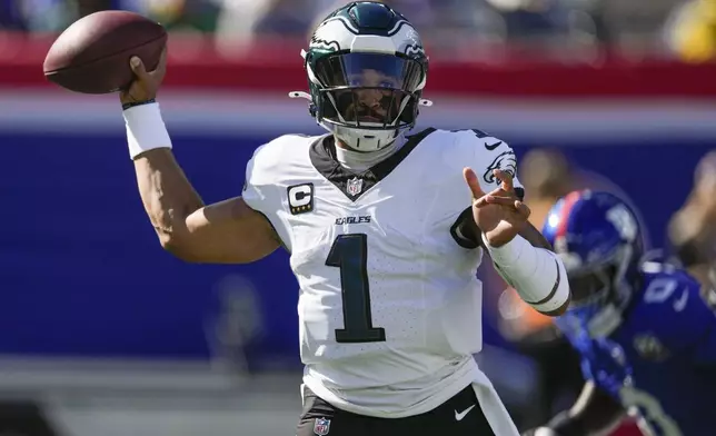 Philadelphia Eagles quarterback Jalen Hurts (1) passes against the New York Giants during the first quarter of an NFL football game, Sunday, Oct. 20, 2024, in East Rutherford, N.J. (AP Photo/Seth Wenig)