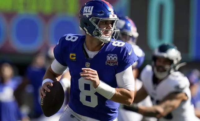 New York Giants quarterback Daniel Jones (8) steps back to pass against the Philadelphia Eagles during the first quarter of an NFL football game, Sunday, Oct. 20, 2024, in East Rutherford, N.J. (AP Photo/Frank Franklin II)