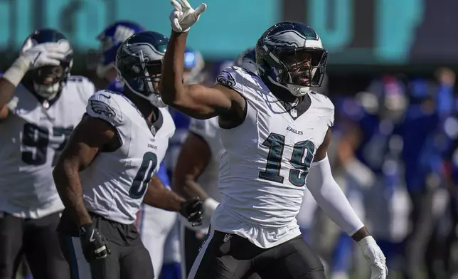 Philadelphia Eagles linebacker Josh Sweat (19) reacts after sacking New York Giants quarterback Daniel Jones (8) during the first quarter of an NFL football game, Sunday, Oct. 20, 2024, in East Rutherford, N.J. (AP Photo/Frank Franklin II)