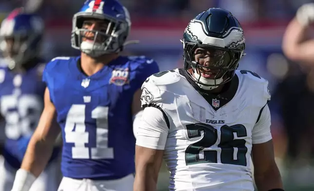 Philadelphia Eagles running back Saquon Barkley (26) reacts after running the ball for a first down against the New York Giants during the third quarter of an NFL football game, Sunday, Oct. 20, 2024, in East Rutherford, N.J. (AP Photo/Seth Wenig)