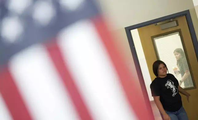 Alisson Ramírez walks into one of her classes at Aurora Hills Middle School, Wednesday, Aug. 28, 2024, in Aurora, Colo. (AP Photo/Godofredo A. Vásquez)