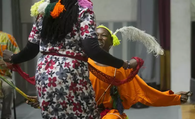 Sudanese Camirata troupe dancers perform a dance from South Sudan, during a show at the Russian culture center in Cairo, Egypt, Sunday, Sept. 15, 2024. (AP Photo/Amr Nabil)