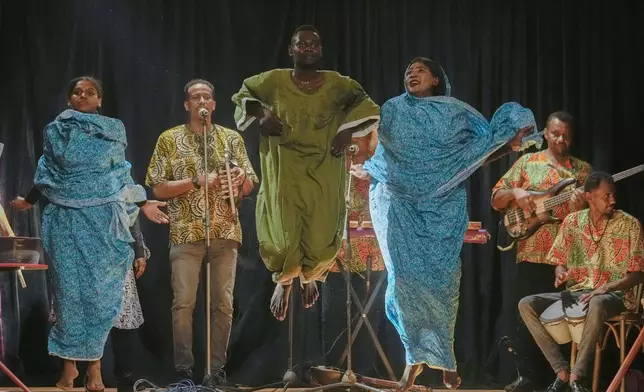 Sudanese Camirata troupe perform at the Italian culture center in Cairo, Egypt, Wednesday, July 24, 2024. (AP Photo/Amr Nabil)