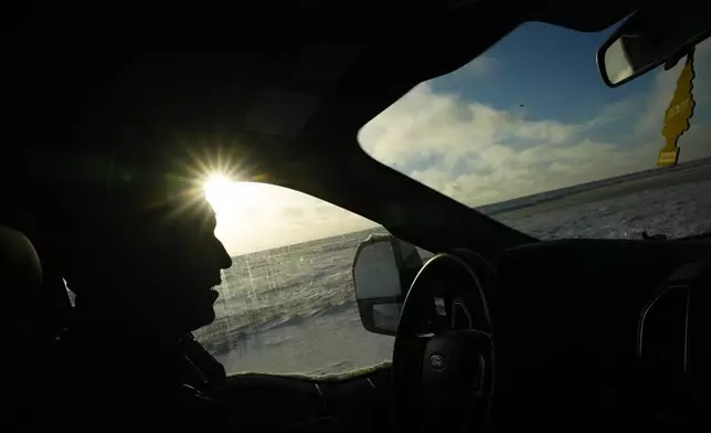 Kaktovik Mayor Nathan Gordon Jr. drives past open tundra on the west side of Barter Island while keeping an eye out for polar bears near Kaktovik, Alaska, Monday, Oct. 14, 2024. (AP Photo/Lindsey Wasson)