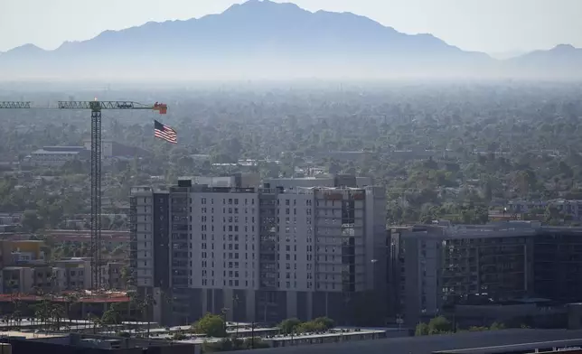 New buildings are going up Tuesday, Sept. 24, 2024, in Tempe, Ariz. (AP Photo/Ross D. Franklin)