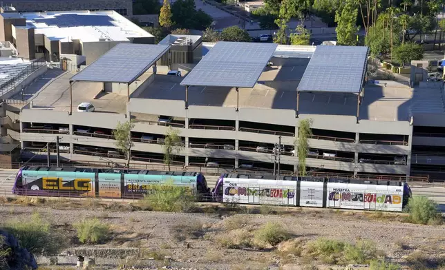 A Valley Metro Rail train moves through Tempe, Ariz., Tuesday, Sept. 24, 2024. (AP Photo/Ross D. Franklin)