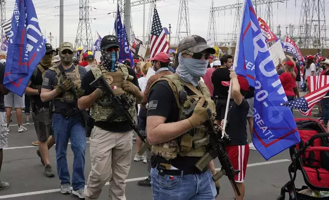 FILE - Supporters of President Donald Trump rally outside the Maricopa County Recorder's Office, Nov. 6, 2020, in Phoenix. (AP Photo/Ross D. Franklin, File)