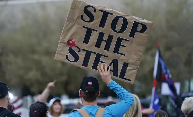 FILE - Supporters of President Donald Trump rally outside the Maricopa County Recorder's Office, Nov. 6, 2020, in Phoenix. (AP Photo/Ross D. Franklin, File)