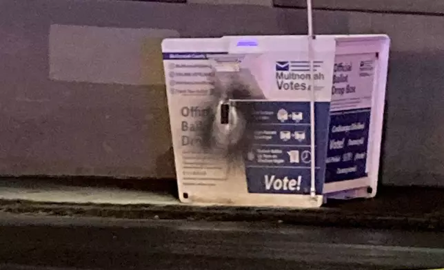 This image released by the Portland Police Bureau shows a ballot box after an incendiary device was discovered inside, in Portland, Ore., Monday, Oct. 28, 2024. (Portland Police Bureau via AP)