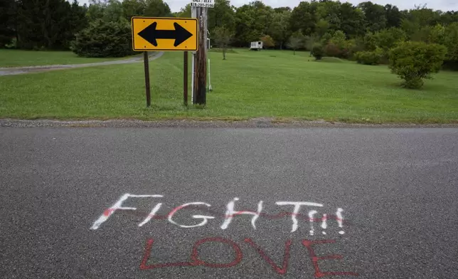 Show in graffiti in the area of the Butler Farm Show, the sight of an assassination attempt against Republican presidential nominee former President Donald Trump in Butler, Saturday, Sept. 28, 2024. (AP Photo/Matt Rourke)